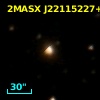 2MASX J22115227+0740232