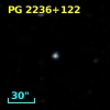 2MASS J22390611+1230351
