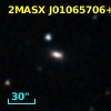 2MASX J01065706+3237204