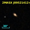2MASX J09521412+0014089