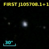 2MASX J10570802+1821284