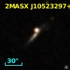 2MASX J10523297+1036205