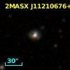 2MASX J11210676+1657313