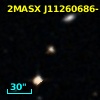 2MASX J11260686-1235542