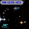 AM 1128-421