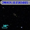 2MASX J11565665-0323556