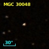 2MASS J12112483-0006379