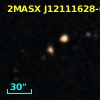 2MASX J12111628-0539563