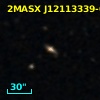 2MASX J12113339-0538209