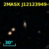 2MASX J12123949-0558515