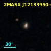 2MASX J12133950-0557544