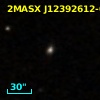 2MASX J12392612-0302216