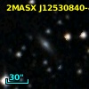 2MASX J12530840-4112422