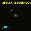 2MASX J13005400+2411542