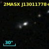 2MASX J13011778+2114358