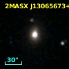 2MASX J13065673+1853536