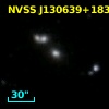 2MASX J13063977+1835430