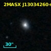2MASX J13034260+0311043