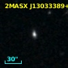 2MASX J13033389+0402582