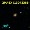 2MASX J13042385-0301555