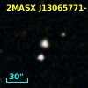 2MASX J13065771-1103388
