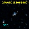 2MASX J13065987-4313537
