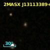 2MASX J13113389+3721296