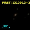 2MASX J13102034+2103256