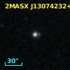 2MASX J13074232+0313155