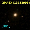 2MASX J13112995+0008576