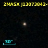 2MASX J13073842-0339297