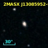 2MASX J13085952-0954342