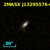 2MASX J13295576+0007074