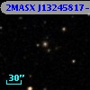 2MASX J13245817-0349340