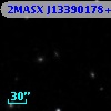 2MASX J13390178+2057213