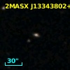 2MASX J13343802+0012597