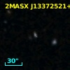 2MASX J13372521+0013524