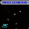 2MASX J13402845-0305577