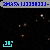 2MASX J13380331-1223446