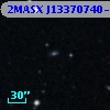 2MASX J13370740-2410045