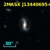 2MASX J13440695+1207377