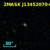 2MASX J13452070+0003259