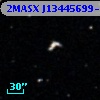 2MASX J13445699-0610517