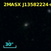 2MASX J13582224+1817598