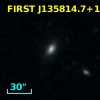 2MASX J13581472+1820457