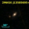 2MASX J13585695+1519381
