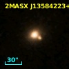 2MASX J13584223+1327231