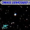 2MASS J19425687-0956325