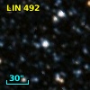 2MASS J01112414-7158403