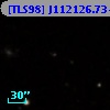 [TLS98] J112126.73+204158.9